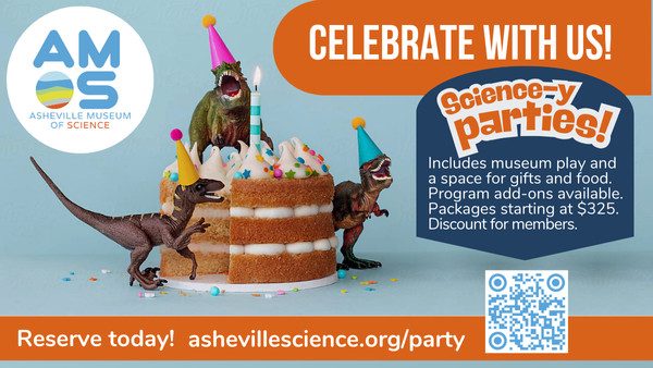 Toy dinos in party hats with a birthday cake